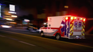 Catastrophic Personal Injury Attorney Atlanta GA - An ambulance speeding through traffic at nighttime